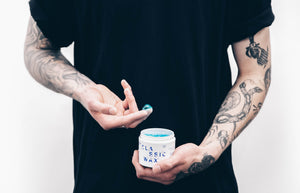 Men's grooming light hold pomade. Water based, classic wax. Formulated by barbers, smells like coconut, washes out with water.
